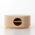 Mesa de centro redonda beige de la marca washablesofaco con abertura circular, perfecta para muebles auxiliares en el hogar.